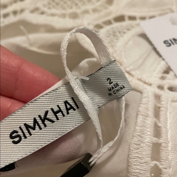 SIMKHAI Ivory Morrigan Short Sleeve Mini Dress. Models is wearing size 2. - Picture 8 of 8